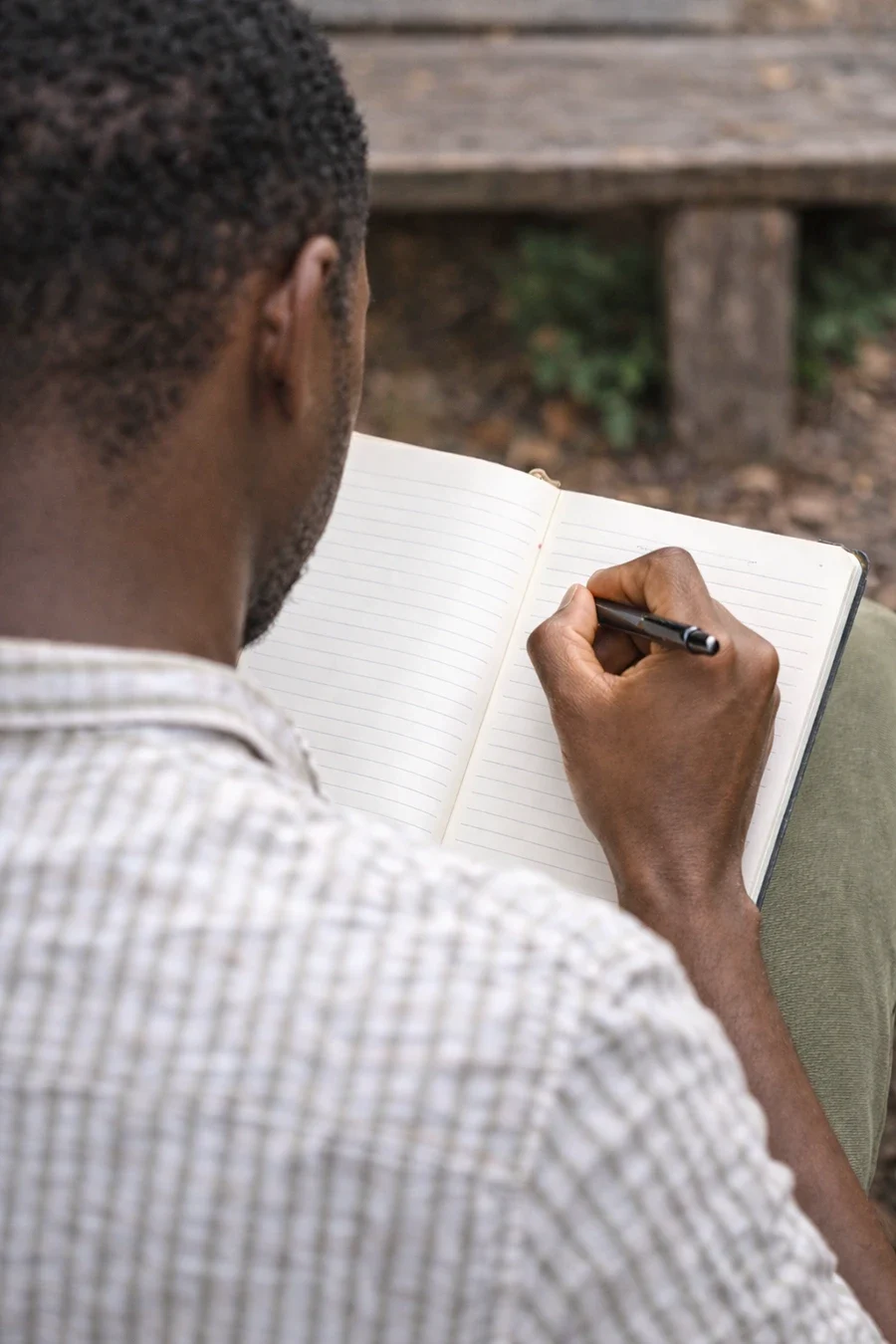 Man writing in notebook